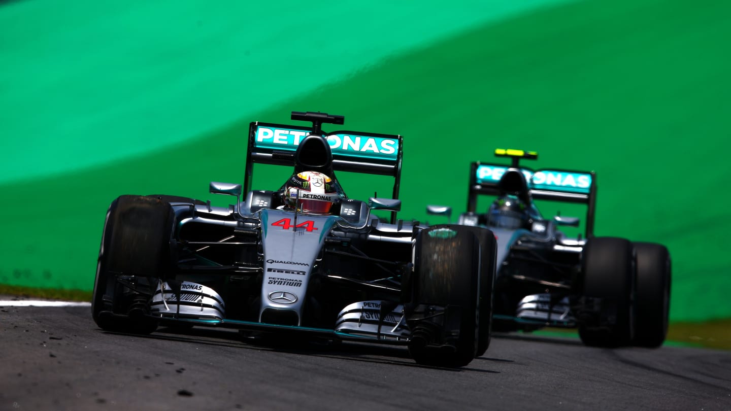 SAO PAULO, BRAZIL - NOVEMBER 14:  Lewis Hamilton of Great Britain and Mercedes GP drives ahead of