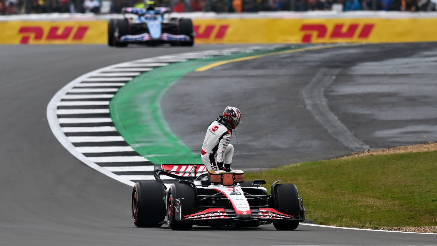 NORTHAMPTON, ENGLAND - JULY 08: Kevin Magnussen of Denmark and Haas F1 climbs from his car after