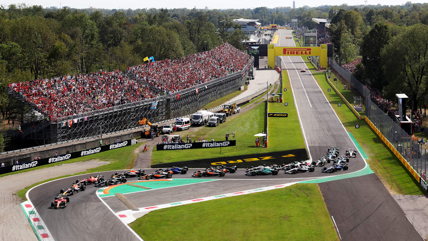 MONZA, ITALY - SEPTEMBER 03: Carlos Sainz of Spain driving (55) the Ferrari SF-23 leads Max