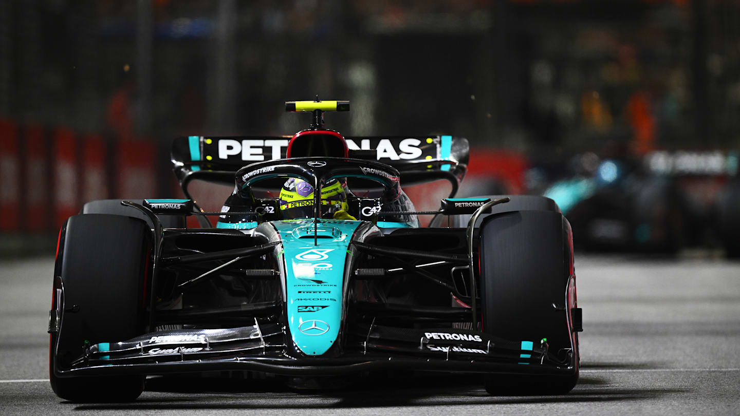 SINGAPORE, SINGAPORE - SEPTEMBER 22: Lewis Hamilton of Great Britain driving the (44) Mercedes AMG