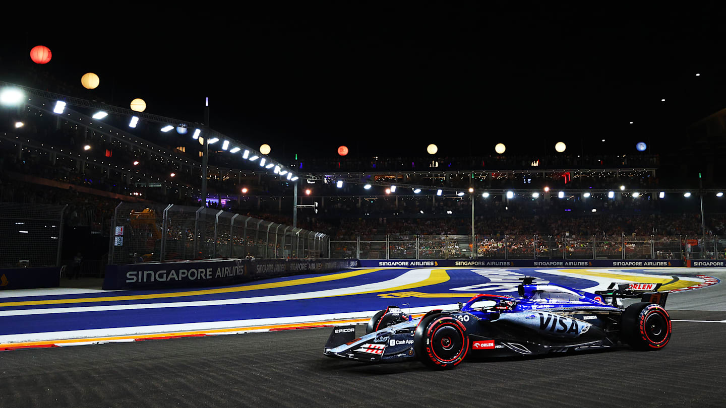 SINGAPORE, SINGAPORE - SEPTEMBER 21: Daniel Ricciardo of Australia driving the (3) Visa Cash App RB
