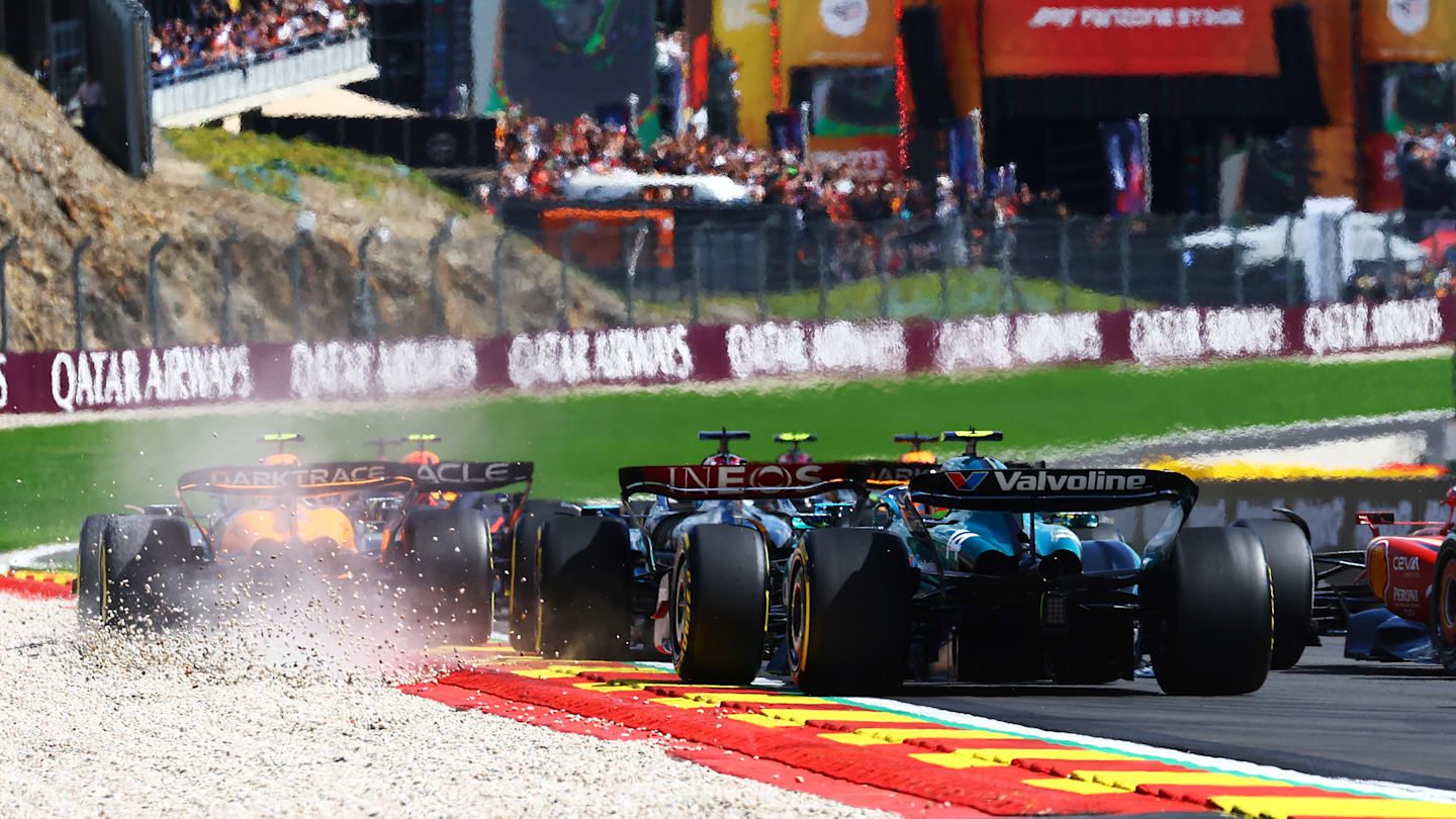 SPA, BELGIUM - JULY 28: A rear view of the start as Lando Norris of Great Britain driving the (4) McLaren MCL38 Mercedes runs wide during the F1 Grand Prix of Belgium at Circuit de Spa-Francorchamps on July 28, 2024 in Spa, Belgium. (Photo by Mark Thompson/Getty Images)