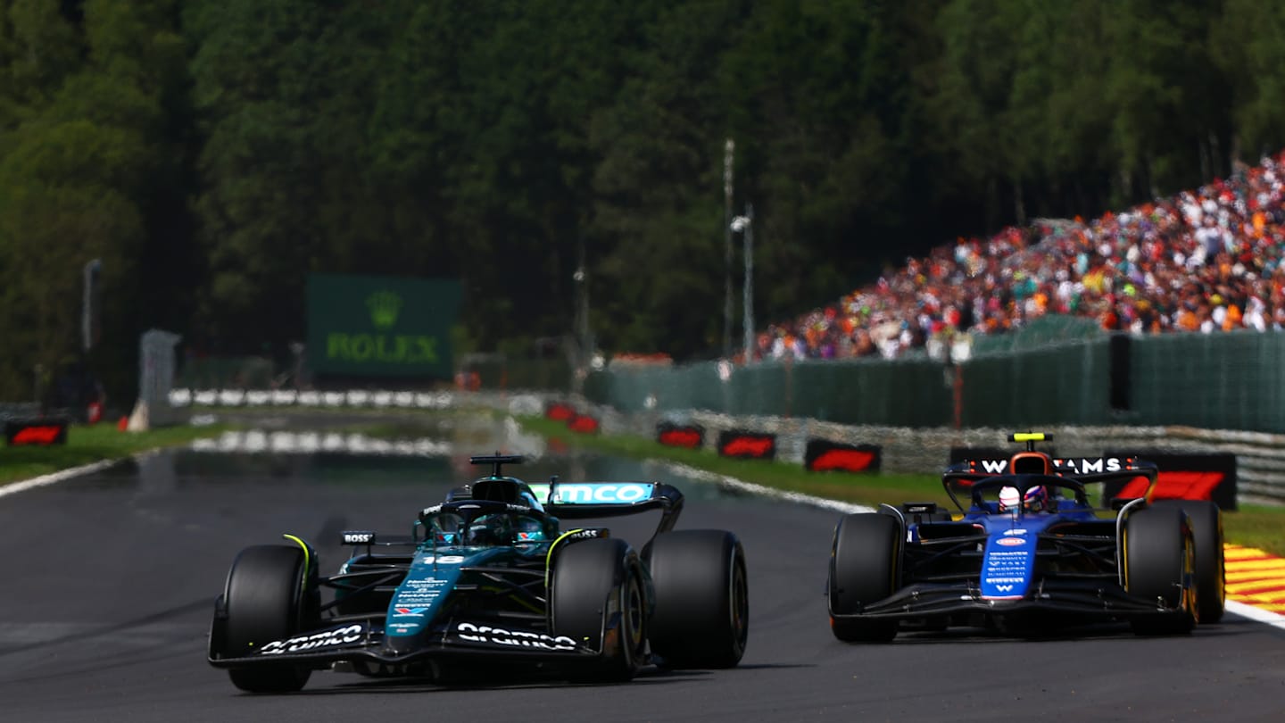 SPA, BELGIUM - JULY 28: Lance Stroll of Canada driving the (18) Aston Martin AMR24 Mercedes leads Logan Sargeant of United States driving the (2) Williams FW46 Mercedes during the F1 Grand Prix of Belgium at Circuit de Spa-Francorchamps on July 28, 2024 in Spa, Belgium. (Photo by Joe Portlock - Formula 1/Formula 1 via Getty Images)