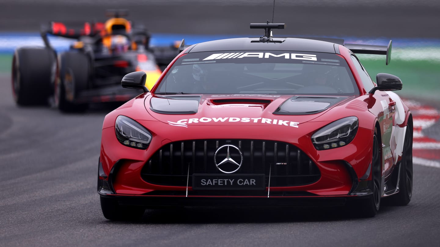 SHANGHAI, CHINA - APRIL 21: The FIA Safety Car leads Max Verstappen of the Netherlands driving the