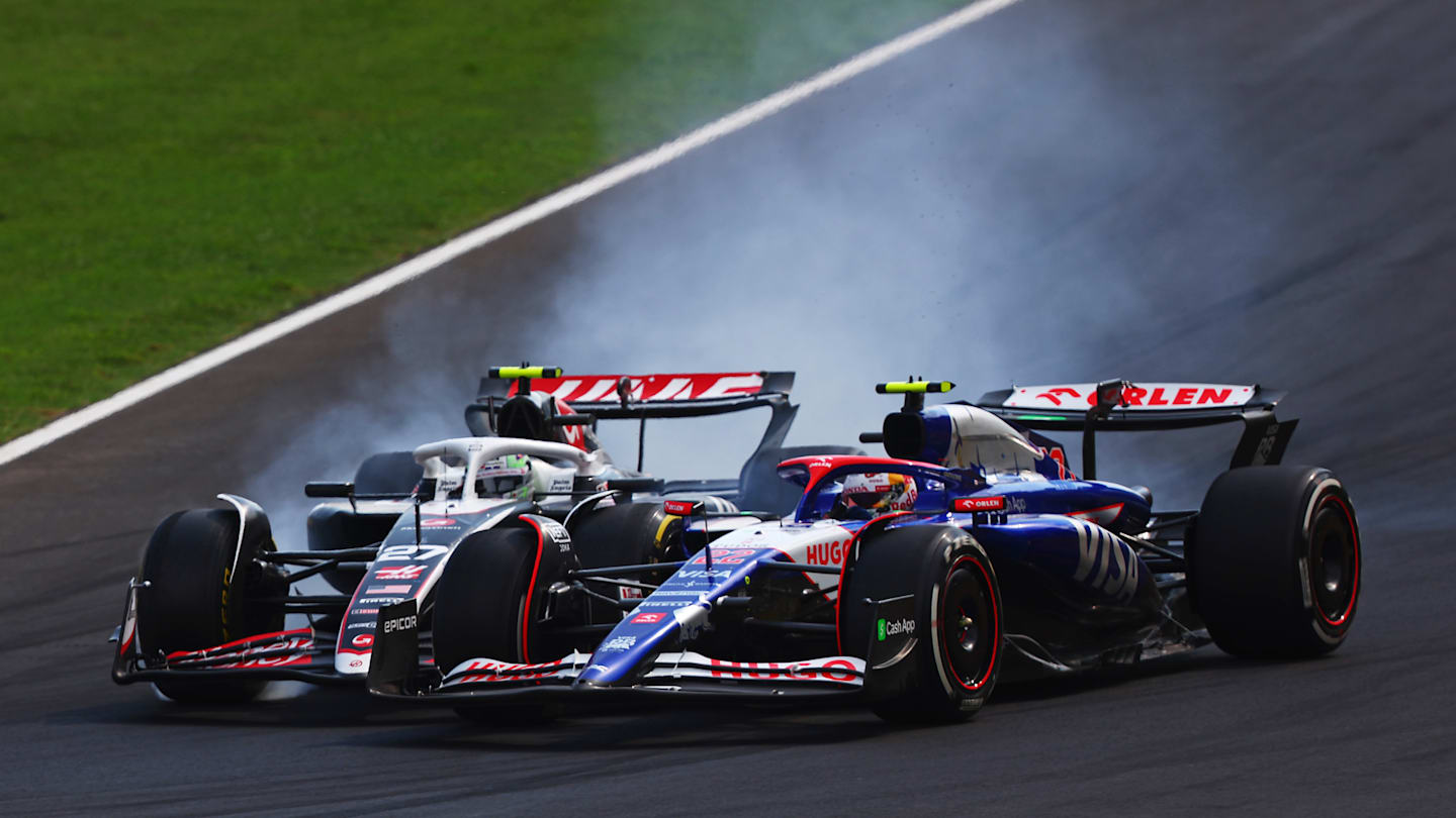 MONZA, ITALY - SEPTEMBER 01: Yuki Tsunoda of Japan driving the (22) Visa Cash App RB VCARB 01 and Nico Hulkenberg of Germany driving the (27) Haas F1 VF-24 Ferrari battle for track position during the F1 Grand Prix of Italy at Autodromo Nazionale Monza on September 01, 2024 in Monza, Italy. (Photo by Joe Portlock - Formula 1/Formula 1 via Getty Images)