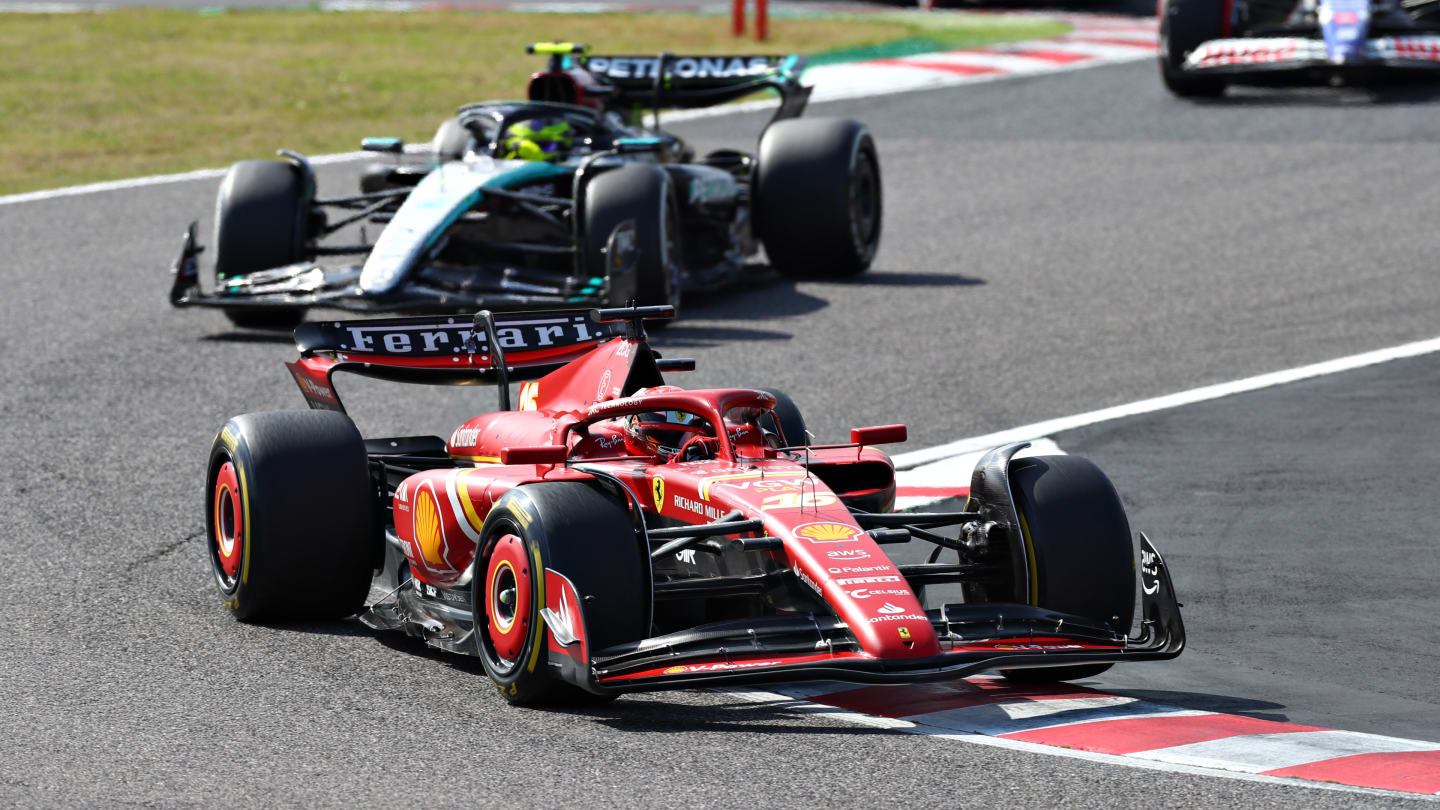 SUZUKA, JAPAN - APRIL 07: Charles Leclerc of Monaco driving the (16) Ferrari SF-24 leads Lewis