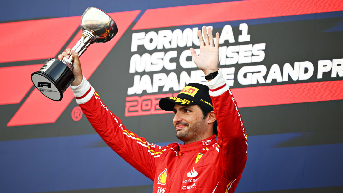 SUZUKA, JAPAN - APRIL 07: Third placed Carlos Sainz of Spain and Ferrari celebrates on the podium