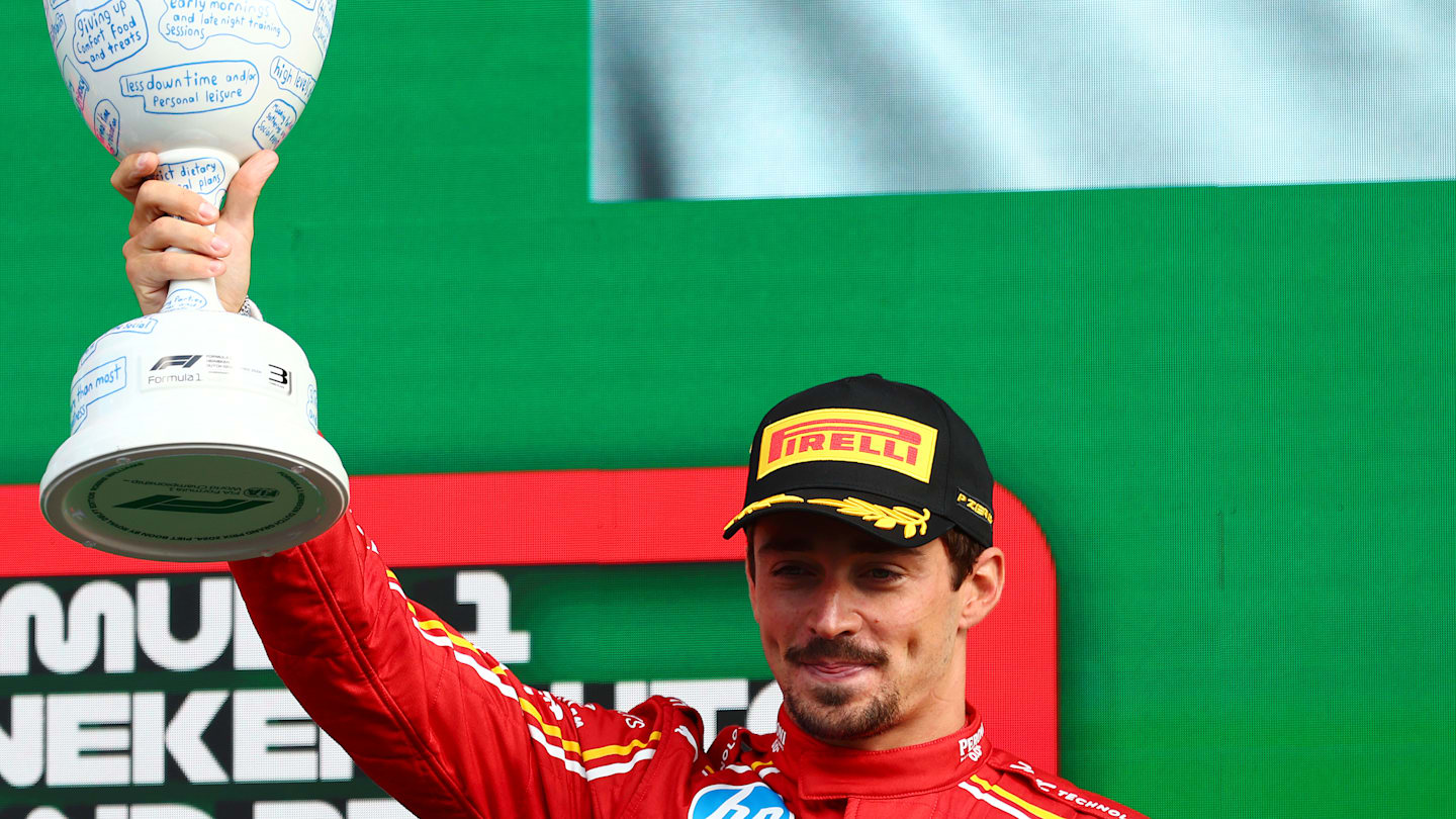 ZANDVOORT, NETHERLANDS - AUGUST 25: Third placed Charles Leclerc of Monaco and Ferrari celebrates