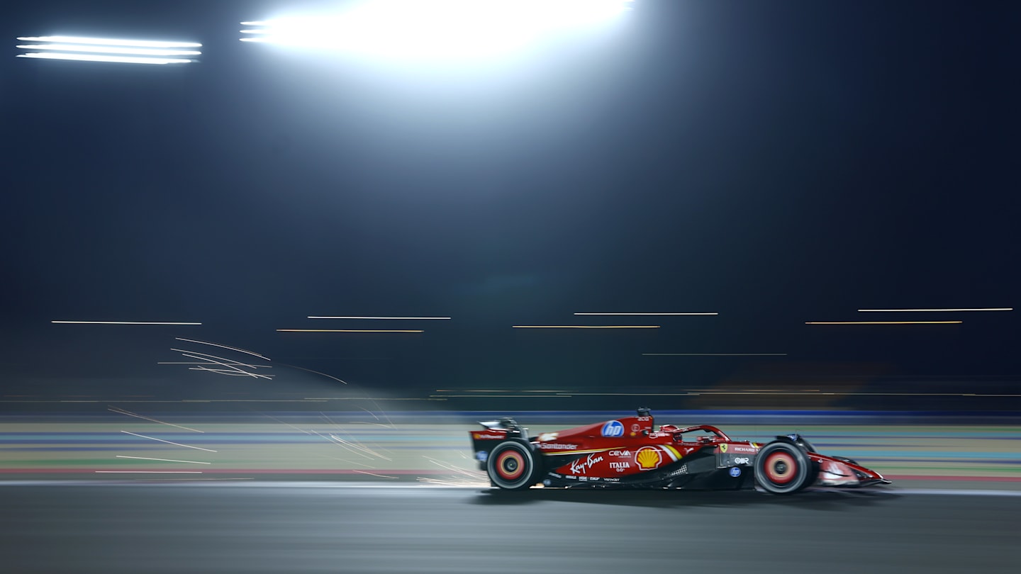 LUSAIL CITY, QATAR - NOVEMBER 29: Sparks fly behind Charles Leclerc of Monaco driving the (16)