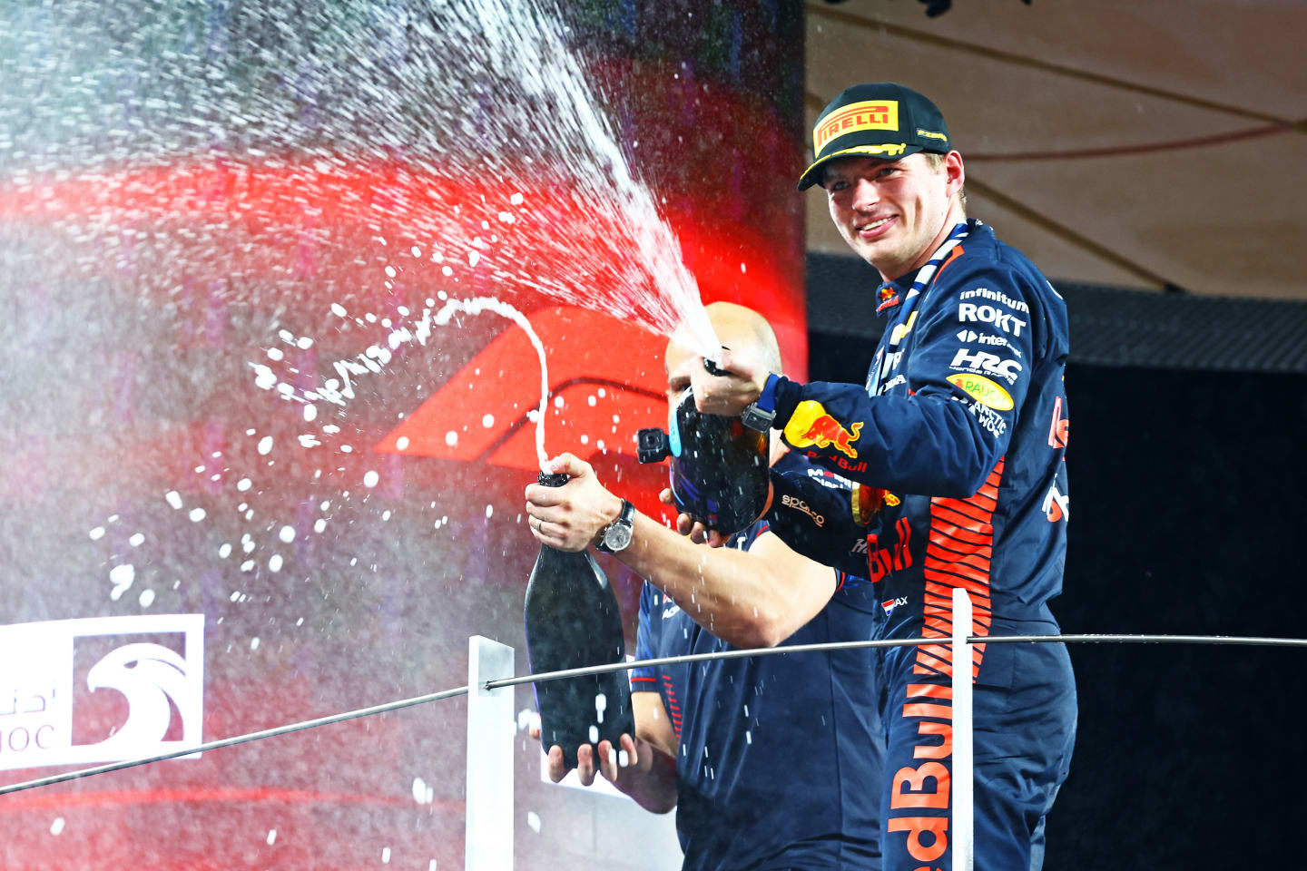 ABU DHABI, UNITED ARAB EMIRATES - NOVEMBER 26: Race winner Max Verstappen of the Netherlands and Oracle Red Bull Racing celebrates on the podium during the F1 Grand Prix of Abu Dhabi at Yas Marina Circuit on November 26, 2023 in Abu Dhabi, United Arab Emirates. (Photo by Mark Thompson/Getty Images)