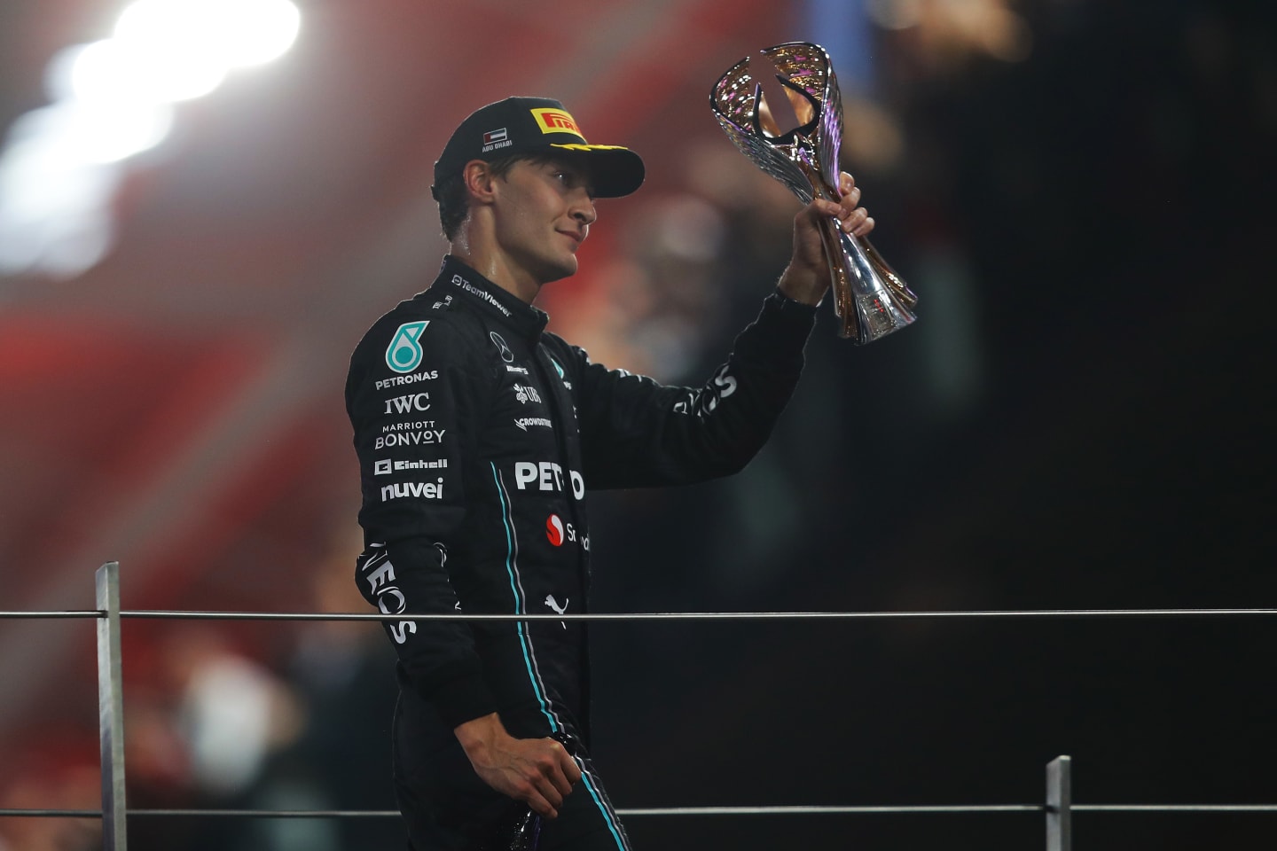 ABU DHABI, UNITED ARAB EMIRATES - NOVEMBER 26: Third placed George Russell of Great Britain and Mercedes celebrates on the podium during the F1 Grand Prix of Abu Dhabi at Yas Marina Circuit on November 26, 2023 in Abu Dhabi, United Arab Emirates. (Photo by Joe Portlock - Formula 1/Formula 1 via Getty Images)