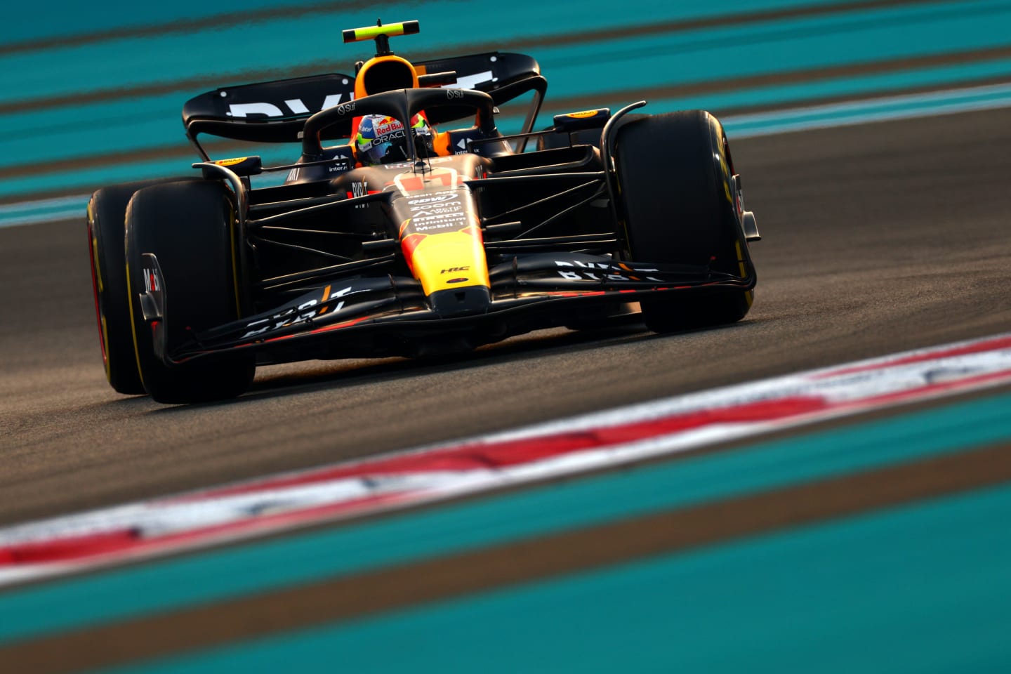 ABU DHABI, UNITED ARAB EMIRATES - NOVEMBER 24: Sergio Perez of Mexico driving the (11) Oracle Red Bull Racing RB19 on track during practice ahead of the F1 Grand Prix of Abu Dhabi at Yas Marina Circuit on November 24, 2023 in Abu Dhabi, United Arab Emirates. (Photo by Clive Rose/Getty Images)