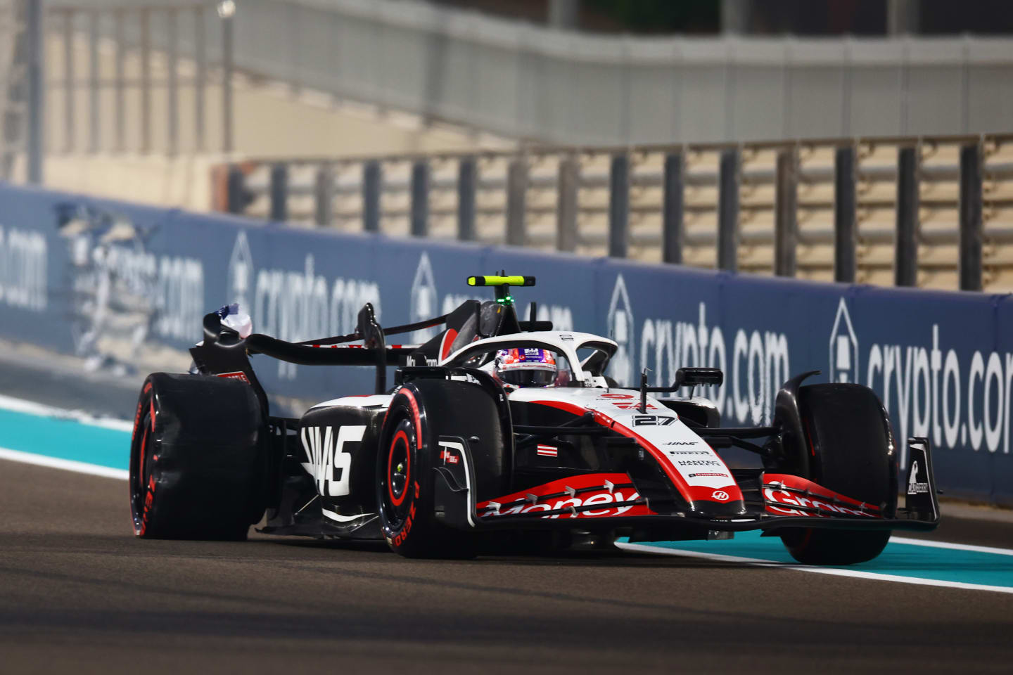 ABU DHABI, UNITED ARAB EMIRATES - NOVEMBER 24: Nico Hulkenberg of Germany driving the (27) Haas F1 VF-23 Ferrari stops on track after crashing during practice ahead of the F1 Grand Prix of Abu Dhabi at Yas Marina Circuit on November 24, 2023 in Abu Dhabi, United Arab Emirates. (Photo by Mark Thompson/Getty Images)