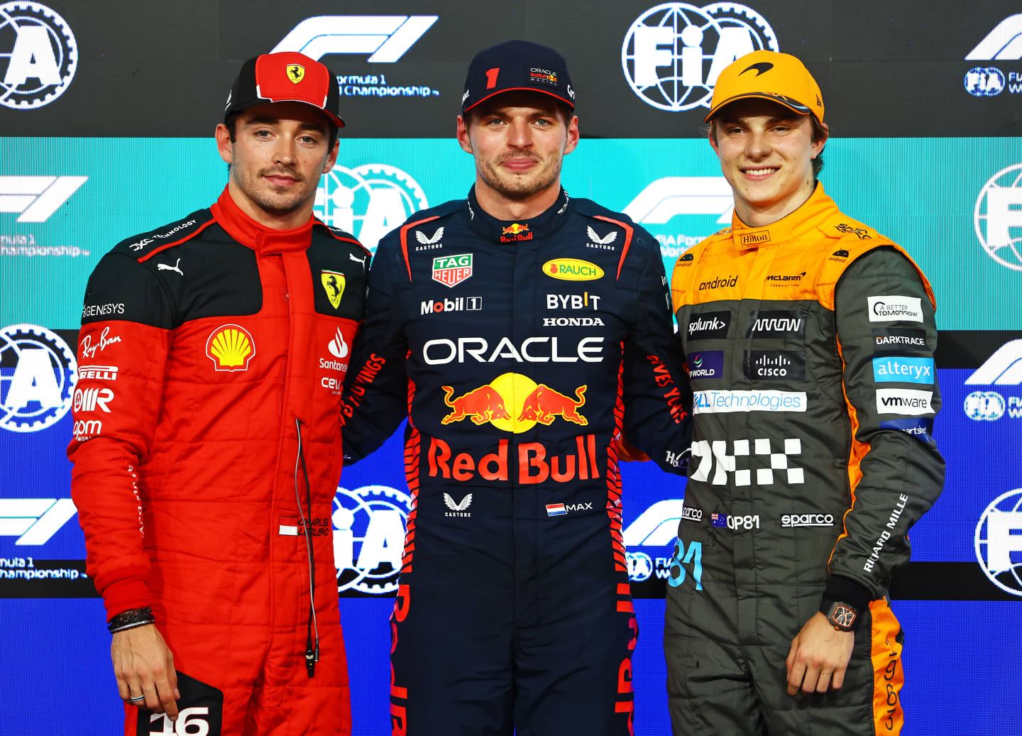 ABU DHABI, UNITED ARAB EMIRATES - NOVEMBER 25: Pole position qualifier Max Verstappen of the Netherlands and Oracle Red Bull Racing (C), Second placed qualifier Charles Leclerc of Monaco and Ferrari (L) and Third placed qualifier Oscar Piastri of Australia and McLaren (R) pose for a photo in parc ferme during qualifying ahead of the F1 Grand Prix of Abu Dhabi at Yas Marina Circuit on November 25, 2023 in Abu Dhabi, United Arab Emirates. (Photo by Mark Thompson/Getty Images)