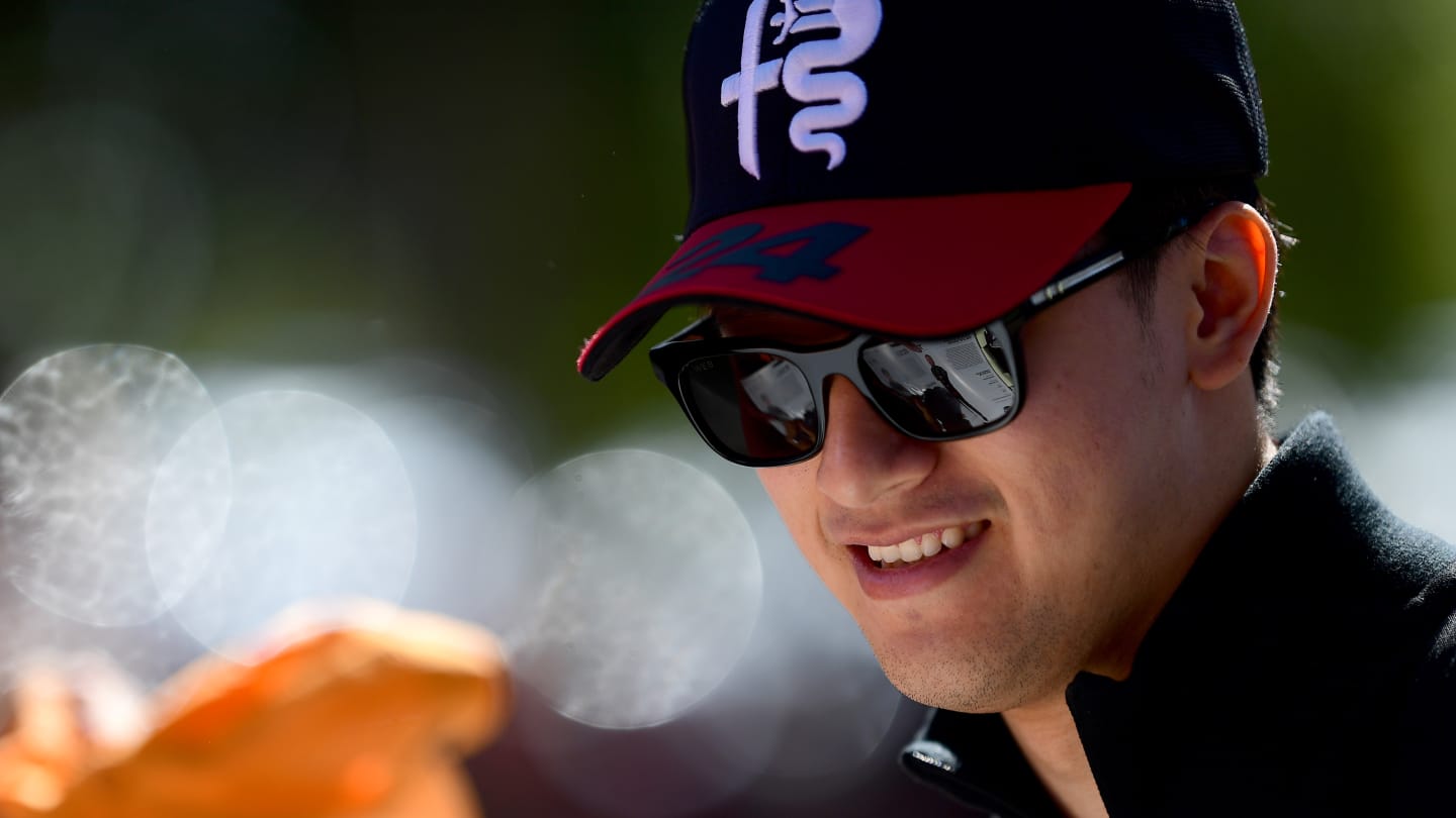 MELBOURNE, AUSTRALIA - APRIL 02: Zhou Guanyu of China and Alfa Romeo F1 greets fans on the