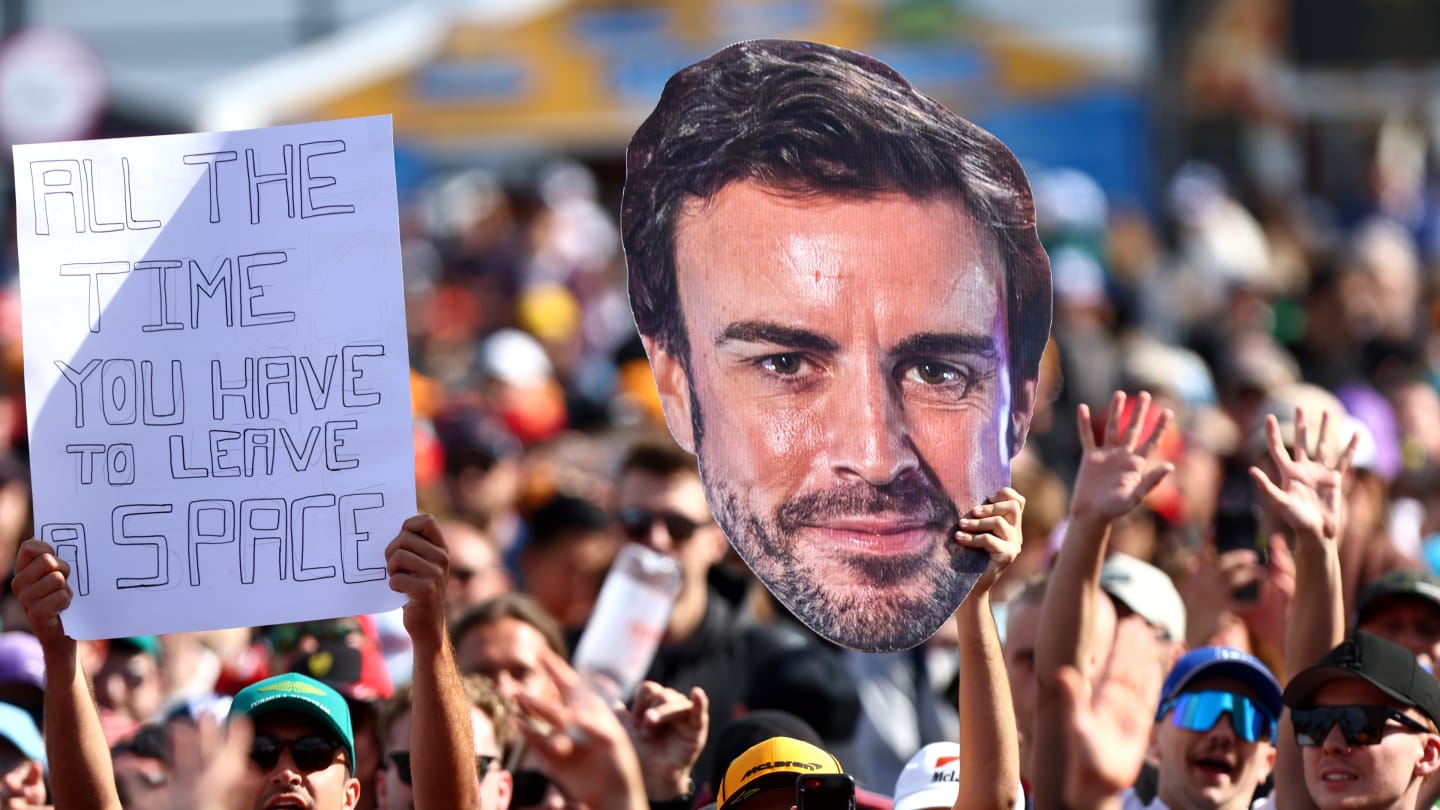 MELBOURNE, AUSTRALIA - MARCH 31: Fernando Alonso of Spain and Aston Martin F1 Team fans show their