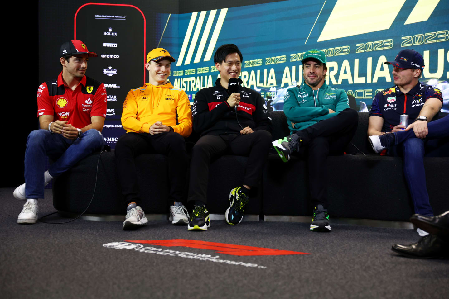 MELBOURNE, AUSTRALIA - MARCH 30: Charles Leclerc of Monaco and Ferrari, Oscar Piastri of Australia