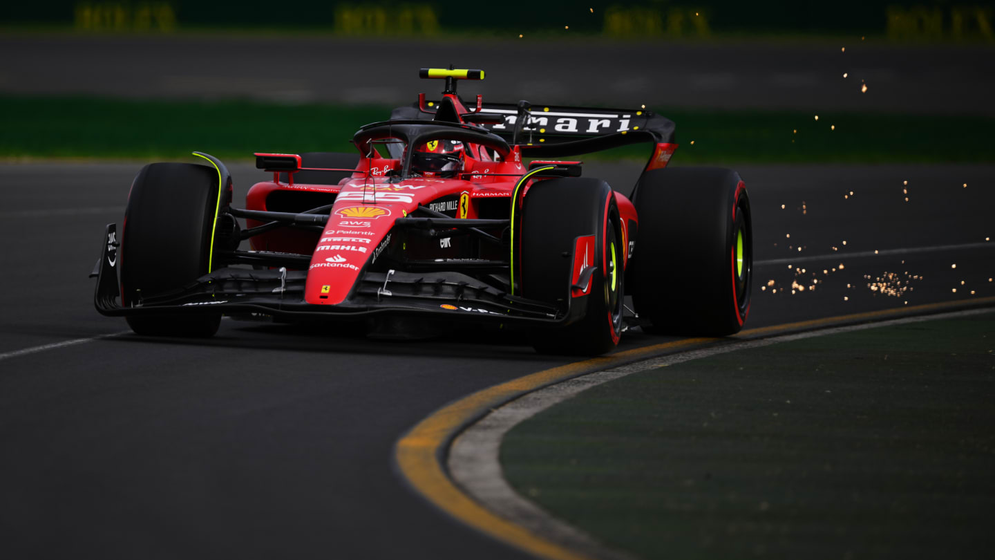 MELBOURNE, AUSTRALIA - APRIL 01: Sparks fly behind Carlos Sainz of Spain driving (55) the Ferrari SF-23  during qualifying ahead of the F1 Grand Prix of Australia at Albert Park Grand Prix Circuit on April 01, 2023 in Melbourne, Australia. (Photo by Clive Mason - Formula 1/Formula 1 via Getty Images)