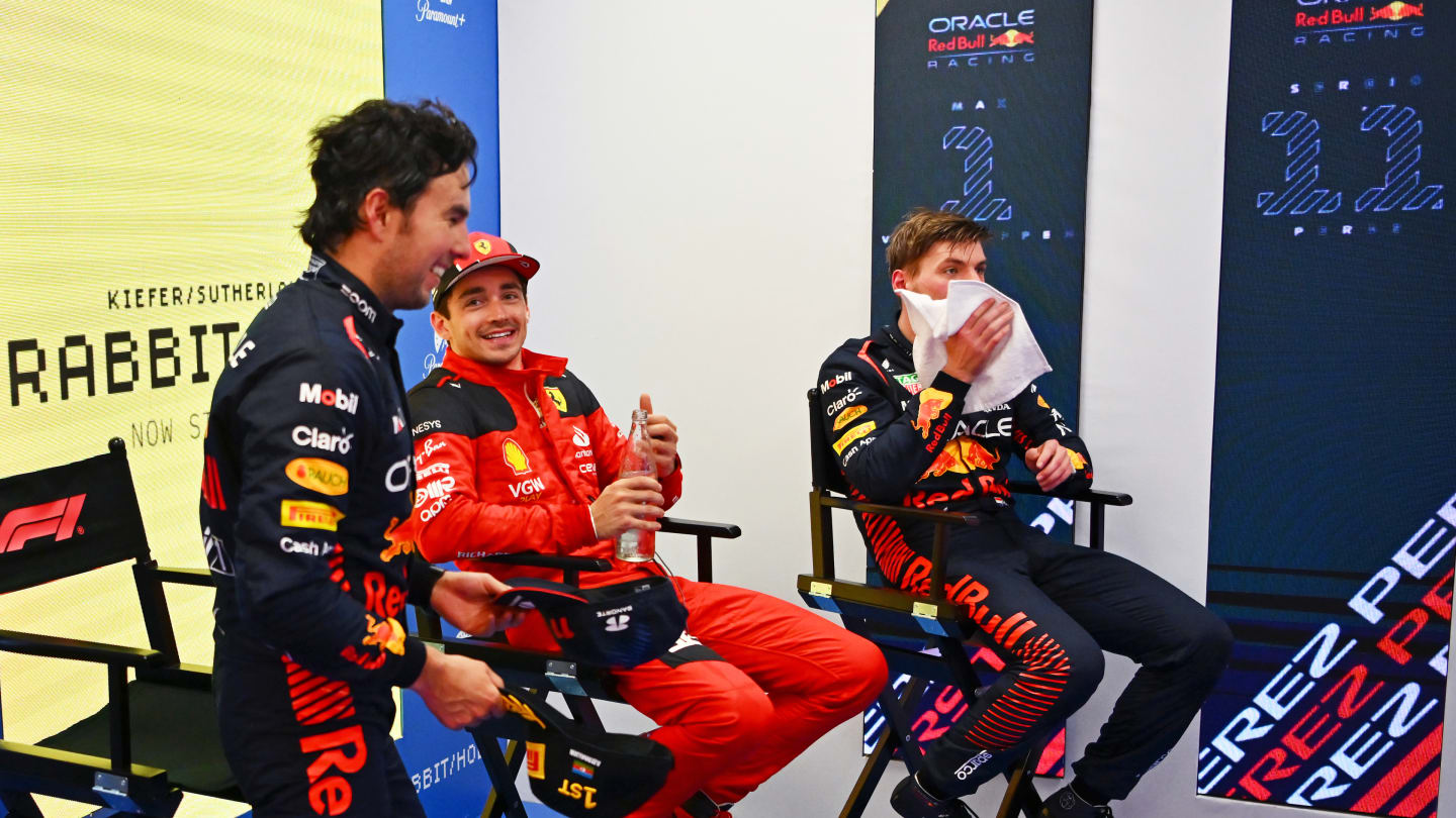BAKU, AZERBAIJAN - APRIL 30: Race winner Sergio Perez of Mexico and Oracle Red Bull Racing (C) Third placed Charles Leclerc of Monaco and Ferrari (L) and Second placed Max Verstappen of the Netherlands and Oracle Red Bull Racing (R) talk ahead of the podium celebrations during the F1 Grand Prix of Azerbaijan at Baku City Circuit on April 30, 2023 in Baku, Azerbaijan. (Photo by Dan Mullan - Formula 1/Formula 1 via Getty Images)
