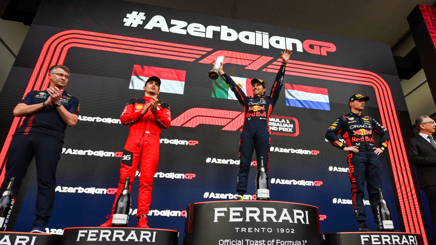BAKU, AZERBAIJAN - APRIL 30: Race winner Sergio Perez of Mexico and Oracle Red Bull Racing, Third placed Charles Leclerc of Monaco and Ferrari, Second placed Max Verstappen of the Netherlands and Oracle Red Bull Racing and Paul Everington, Head of Electronics at Red Bull Racing celebrate on the podium during the F1 Grand Prix of Azerbaijan at Baku City Circuit on April 30, 2023 in Baku, Azerbaijan. (Photo by Dan Mullan - Formula 1/Formula 1 via Getty Images)