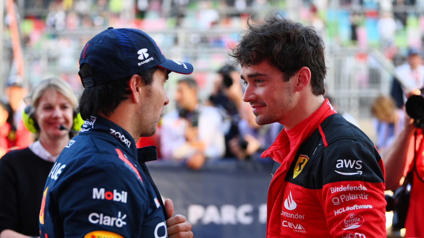 BAKU, AZERBAIJAN - APRIL 28: Pole position qualifier Charles Leclerc of Monaco and Ferrari talks with Third placed qualifier Sergio Perez of Mexico and Oracle Red Bull Racing in parc ferme during qualifying ahead of the F1 Grand Prix of Azerbaijan at Baku City Circuit on April 28, 2023 in Baku, Azerbaijan. (Photo by Dan Mullan - Formula 1/Formula 1 via Getty Images)