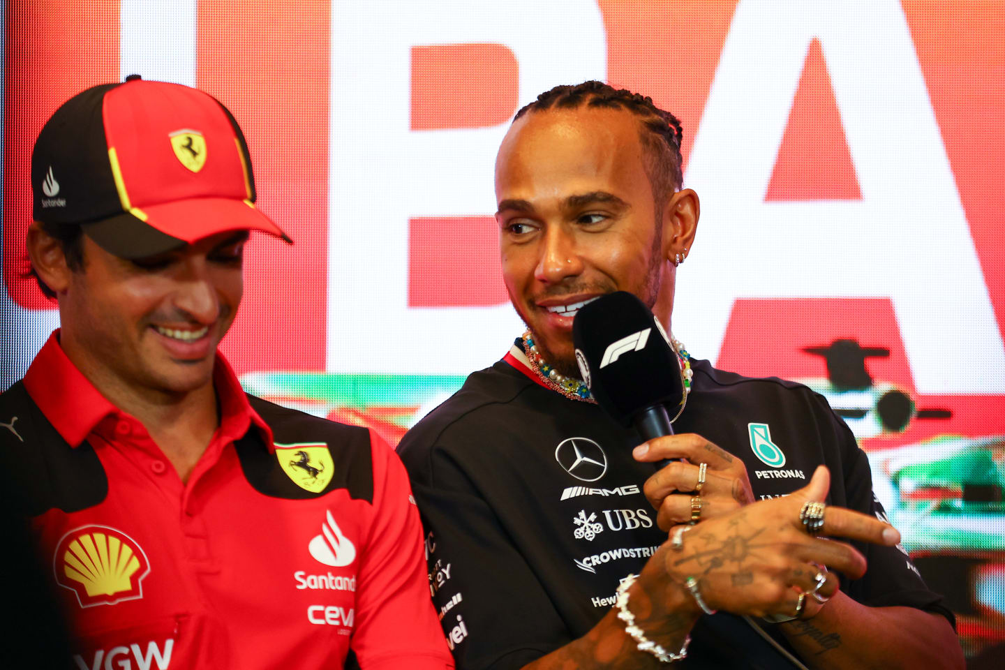 BAKU, AZERBAIJAN - APRIL 27: Lewis Hamilton of Great Britain and Mercedes and Carlos Sainz of Spain and Ferrari talk in a press conference during previews ahead of the F1 Grand Prix of Azerbaijan at Baku City Circuit on April 27, 2023 in Baku, Azerbaijan. (Photo by Bryn Lennon/Getty Images)
