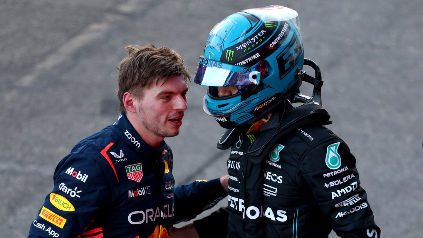 BAKU, AZERBAIJAN - APRIL 29: Third placed Max Verstappen of the Netherlands and Oracle Red Bull Racing and 4th placed George Russell of Great Britain and Mercedes talk in parc ferme during the Sprint ahead of the F1 Grand Prix of Azerbaijan at Baku City Circuit on April 29, 2023 in Baku, Azerbaijan. (Photo by Bryn Lennon - Formula 1/Formula 1 via Getty Images)