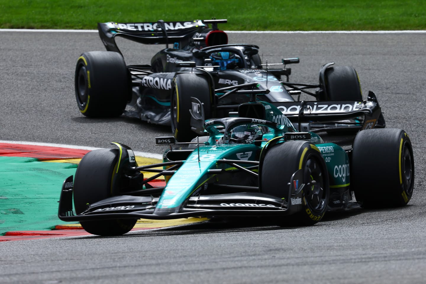 SPA, BELGIUM - JULY 30: Lance Stroll of Canada driving the (18) Aston Martin AMR23 Mercedes George Russell of Great Britain driving the (63) Mercedes AMG Petronas F1 Team W14 on track during the F1 Grand Prix of Belgium at Circuit de Spa-Francorchamps on July 30, 2023 in Spa, Belgium. (Photo by Mark Thompson/Getty Images)