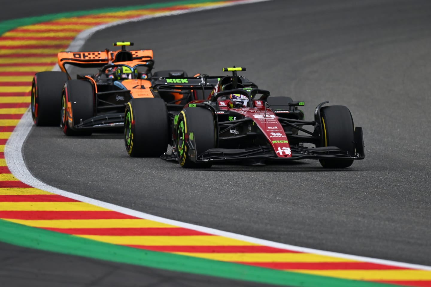 SPA, BELGIUM - JULY 30: Zhou Guanyu of China driving the (24) Alfa Romeo F1 C43 Ferrari leads Lando Norris of Great Britain driving the (4) McLaren MCL60 Mercedes on track during the F1 Grand Prix of Belgium at Circuit de Spa-Francorchamps on July 30, 2023 in Spa, Belgium. (Photo by Dan Mullan/Getty Images)