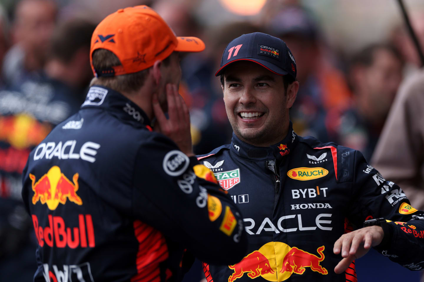 SPA, BELGIUM - JULY 30: Race winner Max Verstappen of the Netherlands and Oracle Red Bull Racing and Second placed Sergio Perez of Mexico and Oracle Red Bull Racing talk in parc ferme during the F1 Grand Prix of Belgium at Circuit de Spa-Francorchamps on July 30, 2023 in Spa, Belgium. (Photo by Dean Mouhtaropoulos - Formula 1/Formula 1 via Getty Images)