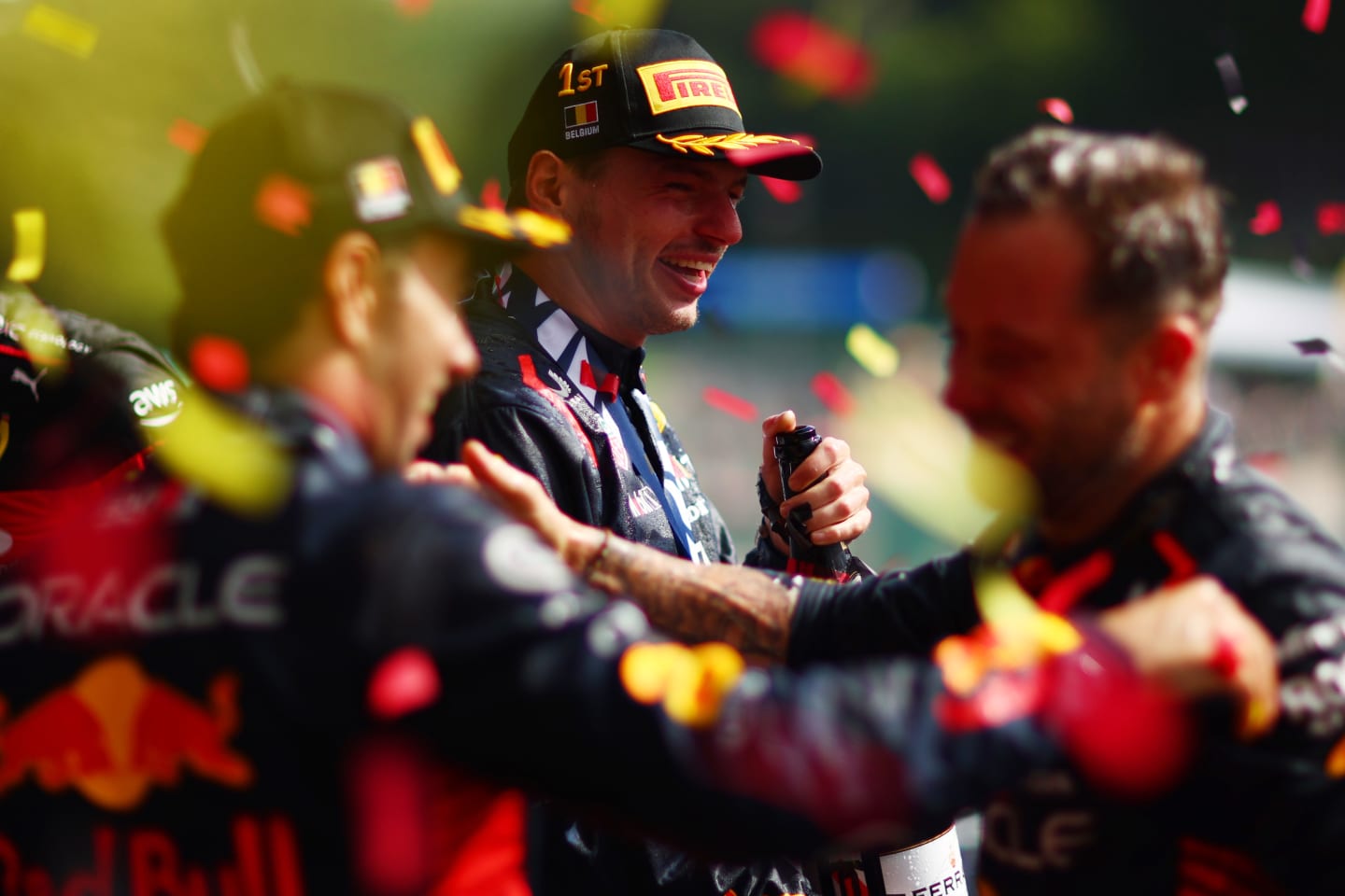 SPA, BELGIUM - JULY 30: Race winner Max Verstappen of the Netherlands and Oracle Red Bull Racing celebrates on the podium with team-mate Sergio Perez of Mexico and Oracle Red Bull Racing during the F1 Grand Prix of Belgium at Circuit de Spa-Francorchamps on July 30, 2023 in Spa, Belgium. (Photo by Dan Istitene - Formula 1/Formula 1 via Getty Images)