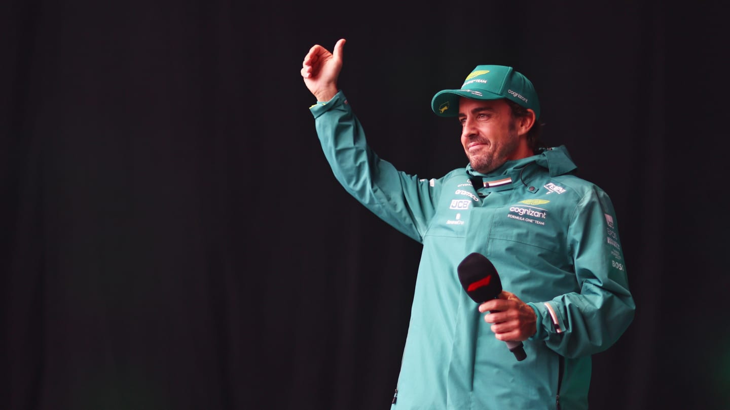 SPA, BELGIUM - JULY 28: Fernando Alonso of Spain and Aston Martin F1 Team talks to the crowd on the