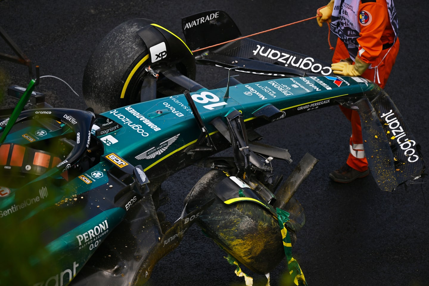 SPA, BELGIUM - JULY 29: The car of Lance Stroll of Canada and Aston Martin F1 Team is removed from the track after a crash during the Sprint Shootout ahead of the F1 Grand Prix of Belgium at Circuit de Spa-Francorchamps on July 29, 2023 in Spa, Belgium. (Photo by Dan Mullan/Getty Images)