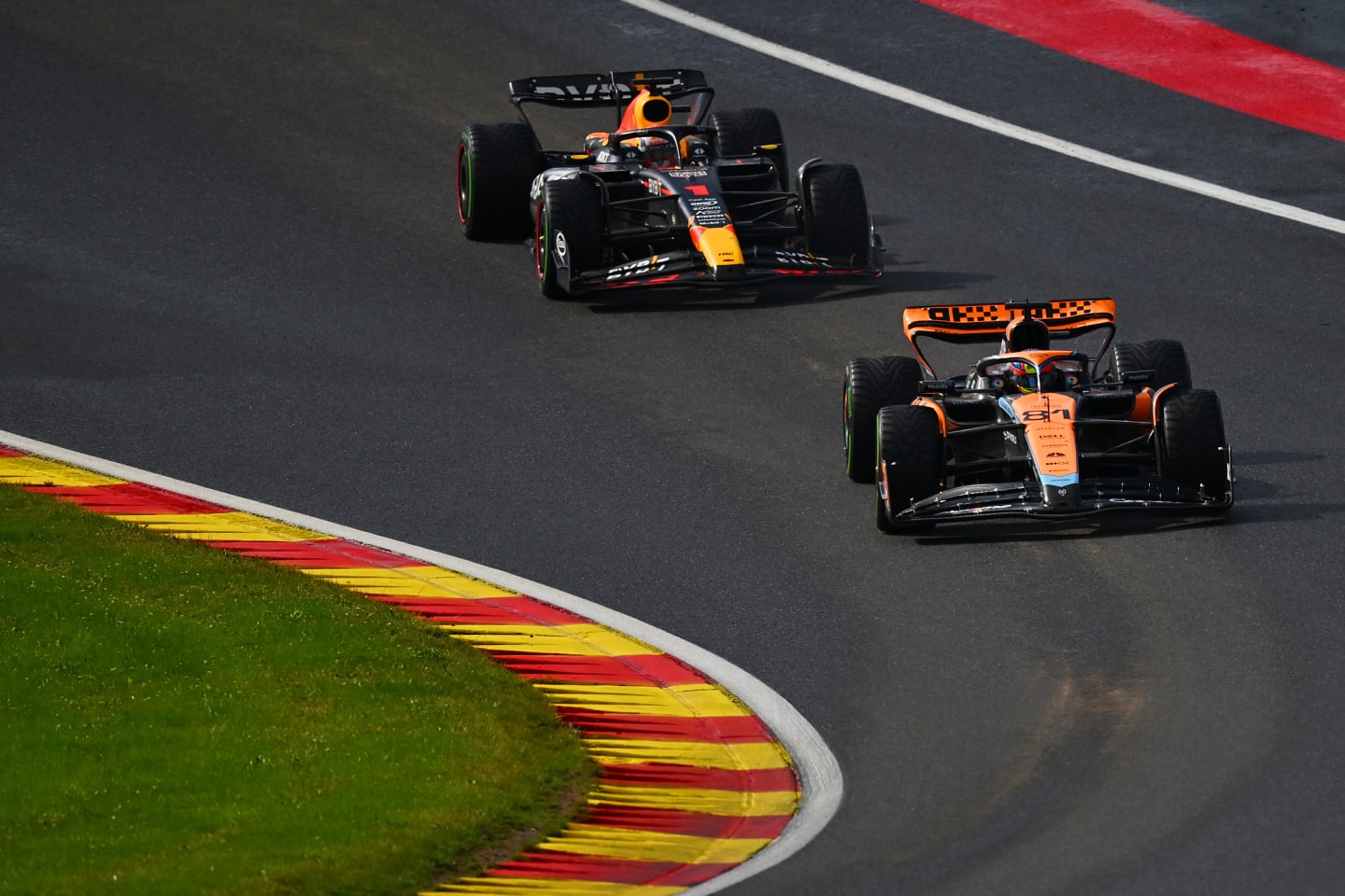 SPA, BELGIUM - JULY 29: Oscar Piastri of Australia driving the (81) McLaren MCL60 Mercedes leads Max Verstappen of the Netherlands driving the (1) Oracle Red Bull Racing RB19 during the Sprint ahead of the F1 Grand Prix of Belgium at Circuit de Spa-Francorchamps on July 29, 2023 in Spa, Belgium. (Photo by Dan Mullan/Getty Images)