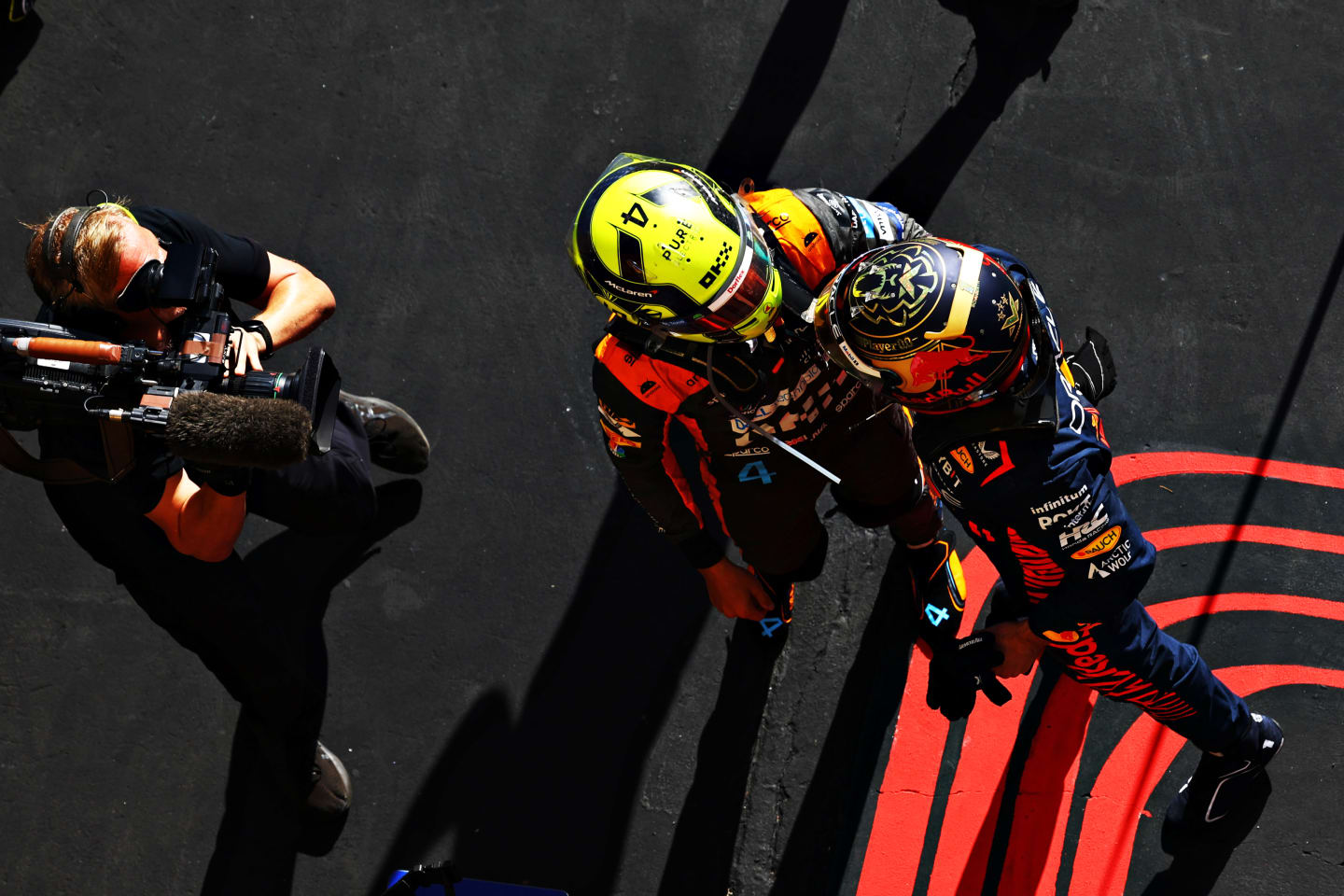 SAO PAULO, BRAZIL - NOVEMBER 05: Race winner Max Verstappen of the Netherlands and Oracle Red Bull Racing and Second placed Lando Norris of Great Britain and McLaren talk in parc ferme during the F1 Grand Prix of Brazil at Autodromo Jose Carlos Pace on November 05, 2023 in Sao Paulo, Brazil. (Photo by Mark Thompson/Getty Images)