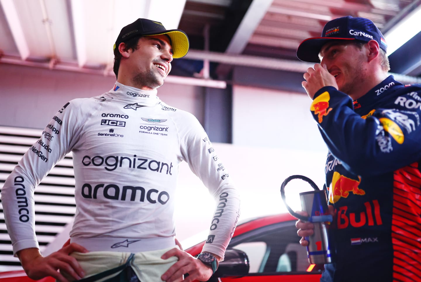 SAO PAULO, BRAZIL - NOVEMBER 03: Pole position qualifier Max Verstappen of the Netherlands and Oracle Red Bull Racing and third placed qualifier Lance Stroll of Canada and Aston Martin F1 Team talk in the FIA Garage after qualifying ahead of the F1 Grand Prix of Brazil at Autodromo Jose Carlos Pace on November 03, 2023 in Sao Paulo, Brazil. (Photo by Dan Istitene - Formula 1/Formula 1 via Getty Images)