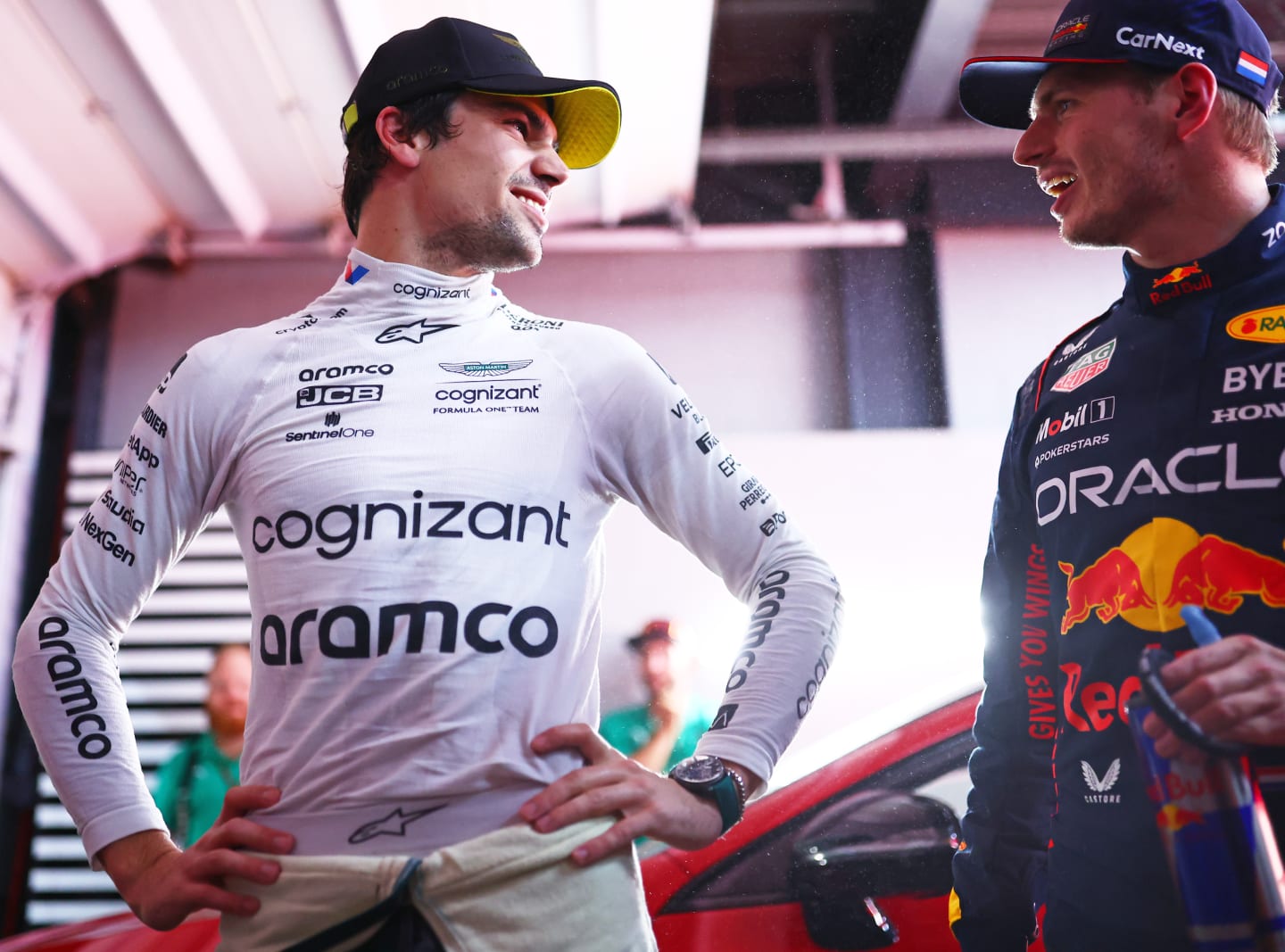 SAO PAULO, BRAZIL - NOVEMBER 03: Pole position qualifier Max Verstappen of the Netherlands and Oracle Red Bull Racing and third placed qualifier Lance Stroll of Canada and Aston Martin F1 Team talk in the FIA Garage after qualifying ahead of the F1 Grand Prix of Brazil at Autodromo Jose Carlos Pace on November 03, 2023 in Sao Paulo, Brazil. (Photo by Dan Istitene - Formula 1/Formula 1 via Getty Images)