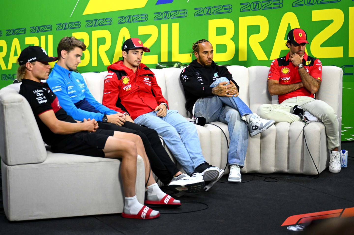 SAO PAULO, BRAZIL - NOVEMBER 02: Valtteri Bottas of Finland and Alfa Romeo F1, Logan Sargeant of United States and Williams, Charles Leclerc of Monaco and Ferrari, Lewis Hamilton of Great Britain and Mercedes and Carlos Sainz of Spain and Ferrari look on in the Drivers Press Conference during previews ahead of the F1 Grand Prix of Brazil at Autodromo Jose Carlos Pace on November 02, 2023 in Sao Paulo, Brazil. (Photo by Clive Mason/Getty Images)