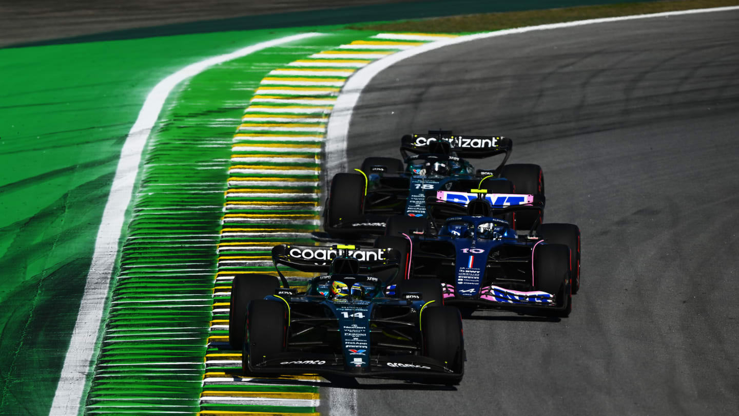 SAO PAULO, BRAZIL - NOVEMBER 04: Fernando Alonso of Spain driving the (14) Aston Martin AMR23 Mercedes leads Pierre Gasly of France driving the (10) Alpine F1 A523 Renault and Lance Stroll of Canada driving the (18) Aston Martin AMR23 Mercedes on track during the Sprint ahead of the F1 Grand Prix of Brazil at Autodromo Jose Carlos Pace on November 04, 2023 in Sao Paulo, Brazil. (Photo by Clive Mason - Formula 1/Formula 1 via Getty Images)