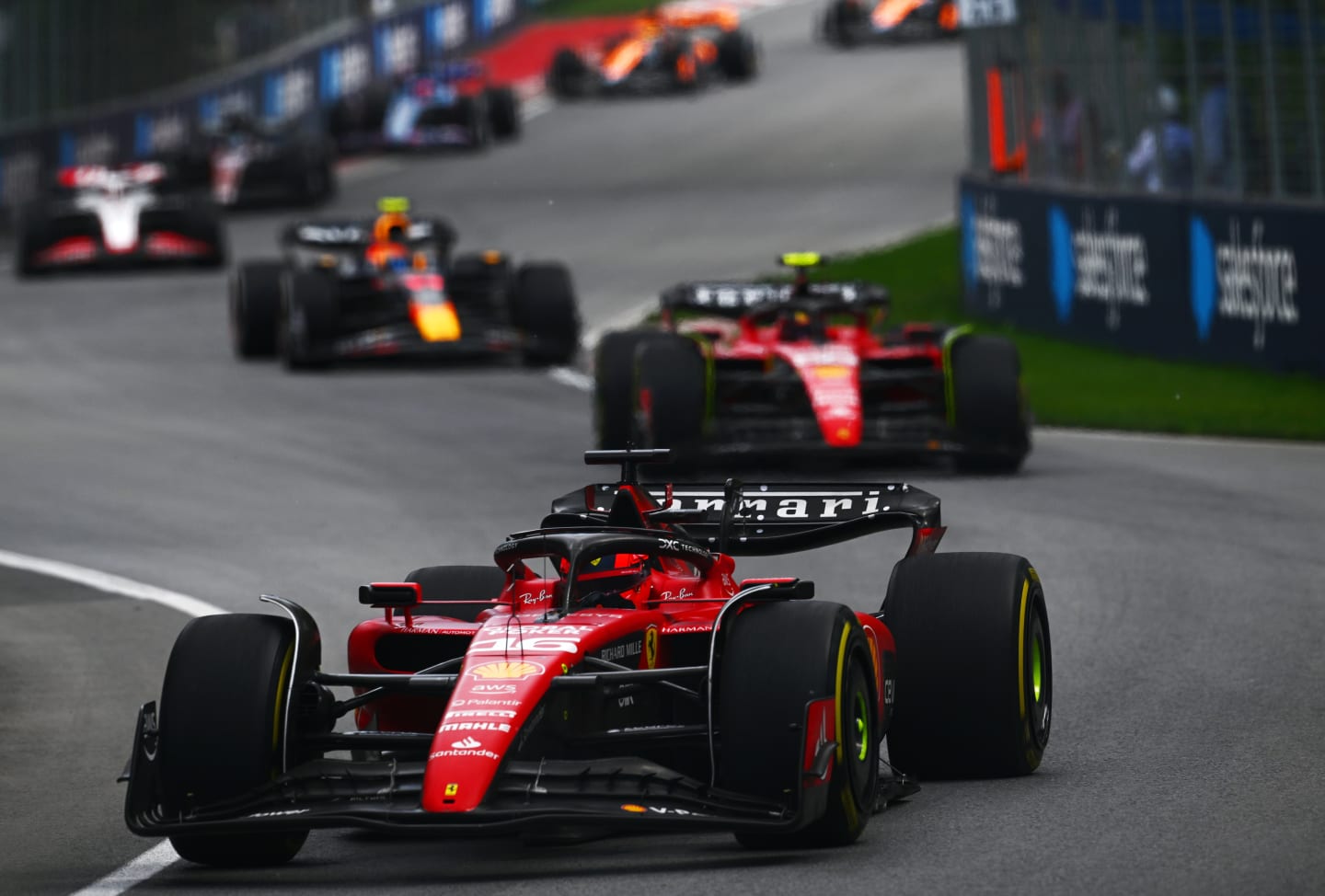 MONTREAL, QUEBEC - JUNE 18: Charles Leclerc of Monaco driving the (16) Ferrari SF-23 leads Carlos