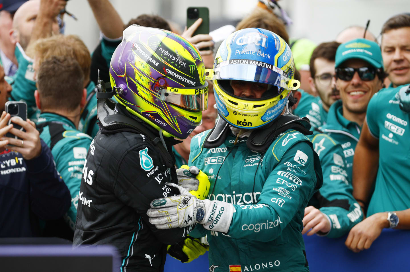 MONTREAL, QUEBEC - JUNE 18: Second placed Fernando Alonso of Spain and Aston Martin F1 Team and Third placed Lewis Hamilton of Great Britain and Mercedes celebrate in parc ferme during the F1 Grand Prix of Canada at Circuit Gilles Villeneuve on June 18, 2023 in Montreal, Quebec. (Photo by Jared C. Tilton/Getty Images)