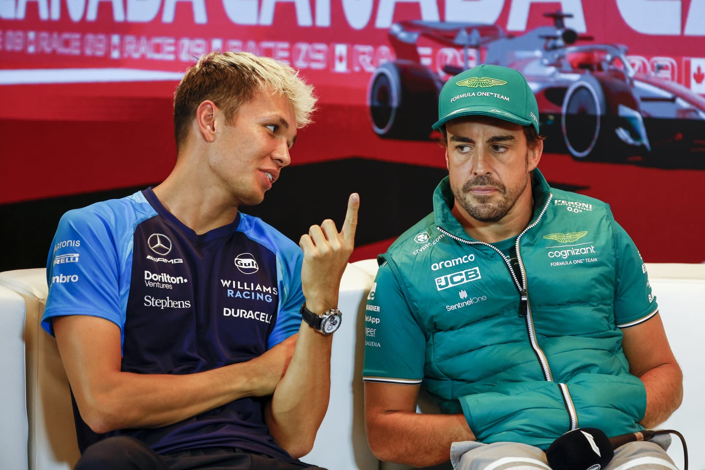 MONTREAL, QUEBEC - JUNE 15: Alexander Albon of Thailand and Williams and Fernando Alonso of Spain and Aston Martin F1 Team talk in the Drivers Press Conference during previews ahead of the F1 Grand Prix of Canada at Circuit Gilles Villeneuve on June 15, 2023 in Montreal, Quebec. (Photo by Jared C. Tilton/Getty Images)