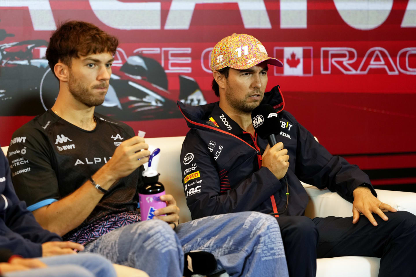 MONTREAL, QUEBEC - JUNE 15: Pierre Gasly of France and Alpine F1 and Sergio Perez of Mexico and Oracle Red Bull Racing attend the Drivers Press Conference during previews ahead of the F1 Grand Prix of Canada at Circuit Gilles Villeneuve on June 15, 2023 in Montreal, Quebec. (Photo by Rudy Carezzevoli/Getty Images)