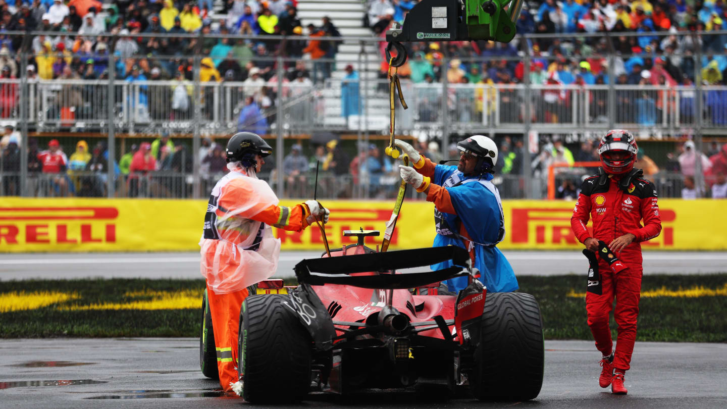 MONTREAL, QUEBEC - JUNE 17: The car of Carlos Sainz of Spain and Ferrari is recovered from the circuit after a crash during final practice ahead of the F1 Grand Prix of Canada at Circuit Gilles Villeneuve on June 17, 2023 in Montreal, Quebec. (Photo by Bryn Lennon - Formula 1/Formula 1 via Getty Images)