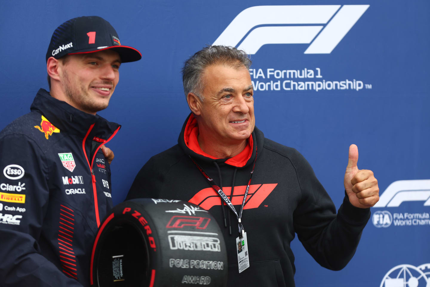 MONTREAL, QUEBEC - JUNE 17: Pole position qualifier Max Verstappen of the Netherlands and Oracle Red Bull Racing is presented with the Pirelli Pole Position award by Jean Alesi in parc ferme during qualifying ahead of the F1 Grand Prix of Canada at Circuit Gilles Villeneuve on June 17, 2023 in Montreal, Quebec. (Photo by Dan Istitene - Formula 1/Formula 1 via Getty Images)