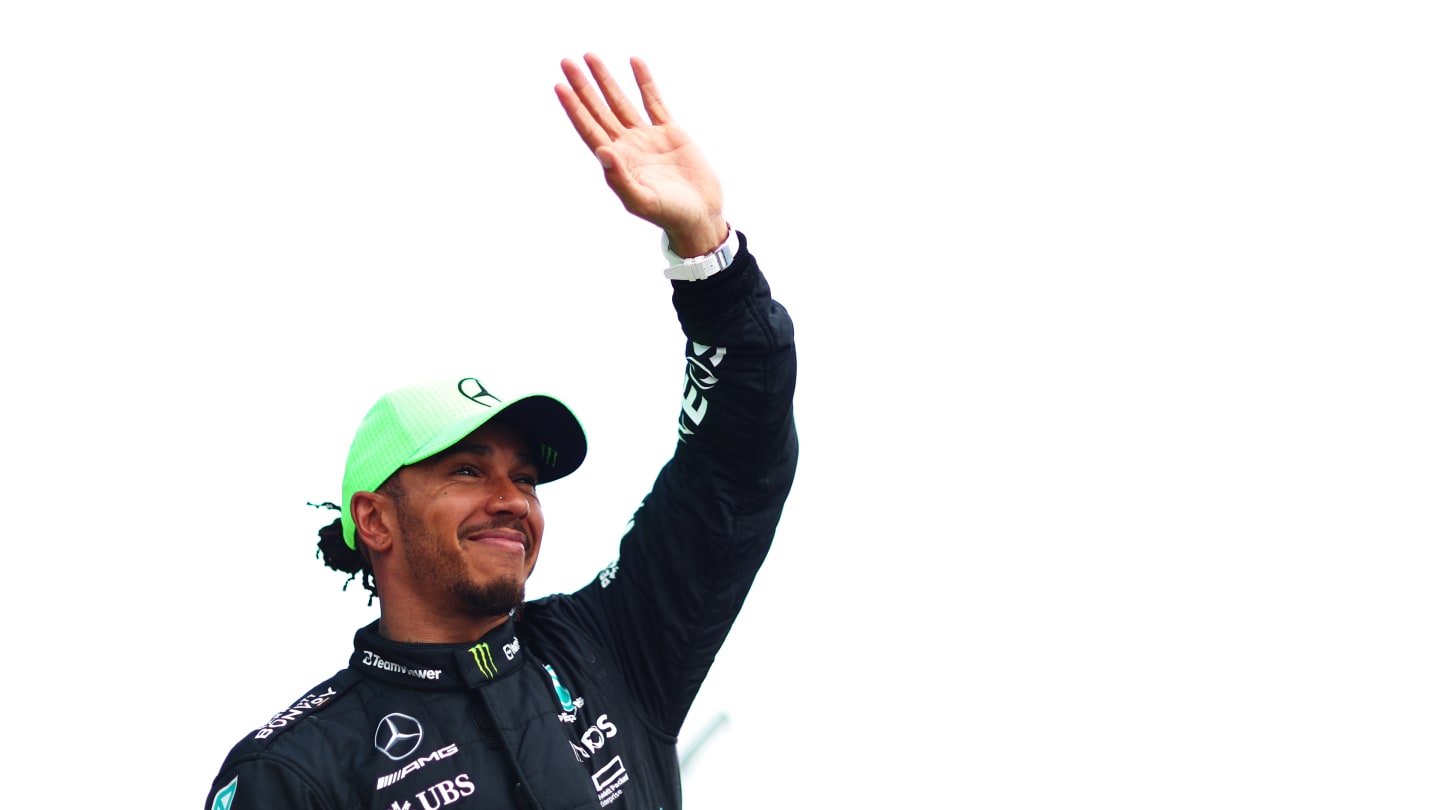 NORTHAMPTON, ENGLAND - JULY 09: Third placed Lewis Hamilton of Great Britain and Mercedes waves to