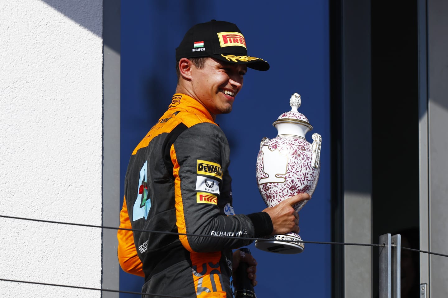 BUDAPEST, HUNGARY - JULY 23: Second placed Lando Norris of Great Britain and McLaren celebrates on the podium during the F1 Grand Prix of Hungary at Hungaroring on July 23, 2023 in Budapest, Hungary. (Photo by Francois Nel/Getty Images)