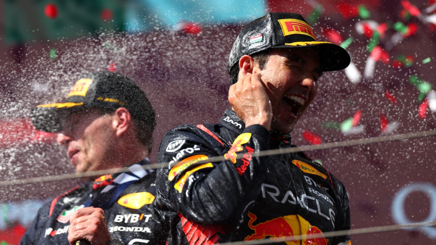BUDAPEST, HUNGARY - JULY 23: Race winner Max Verstappen of the Netherlands and Oracle Red Bull Racing and Third placed Sergio Perez of Mexico and Oracle Red Bull Racing celebrate on the podium during the F1 Grand Prix of Hungary at Hungaroring on July 23, 2023 in Budapest, Hungary. (Photo by Dan Istitene - Formula 1/Formula 1 via Getty Images)