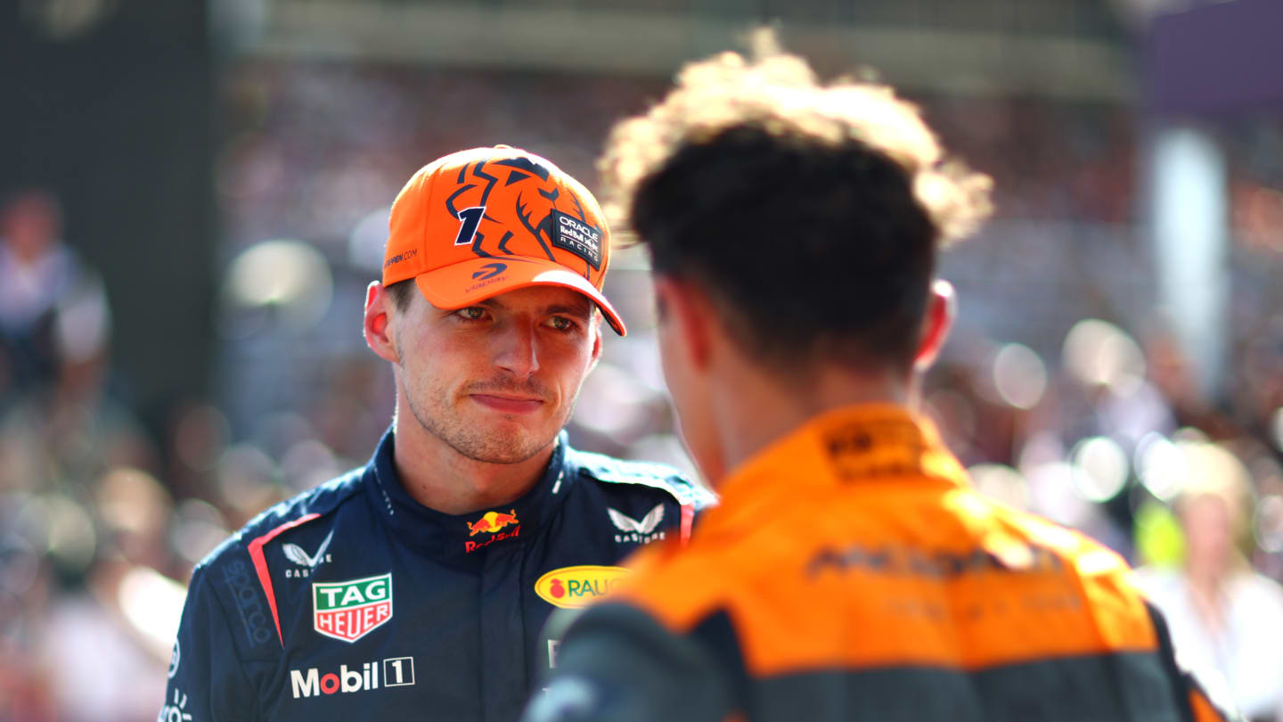 BUDAPEST, HUNGARY - JULY 23: Race winner Max Verstappen of the Netherlands and Oracle Red Bull Racing and Second placed Lando Norris of Great Britain and McLaren talk in parc ferme during the F1 Grand Prix of Hungary at Hungaroring on July 23, 2023 in Budapest, Hungary. (Photo by Dan Istitene - Formula 1/Formula 1 via Getty Images)