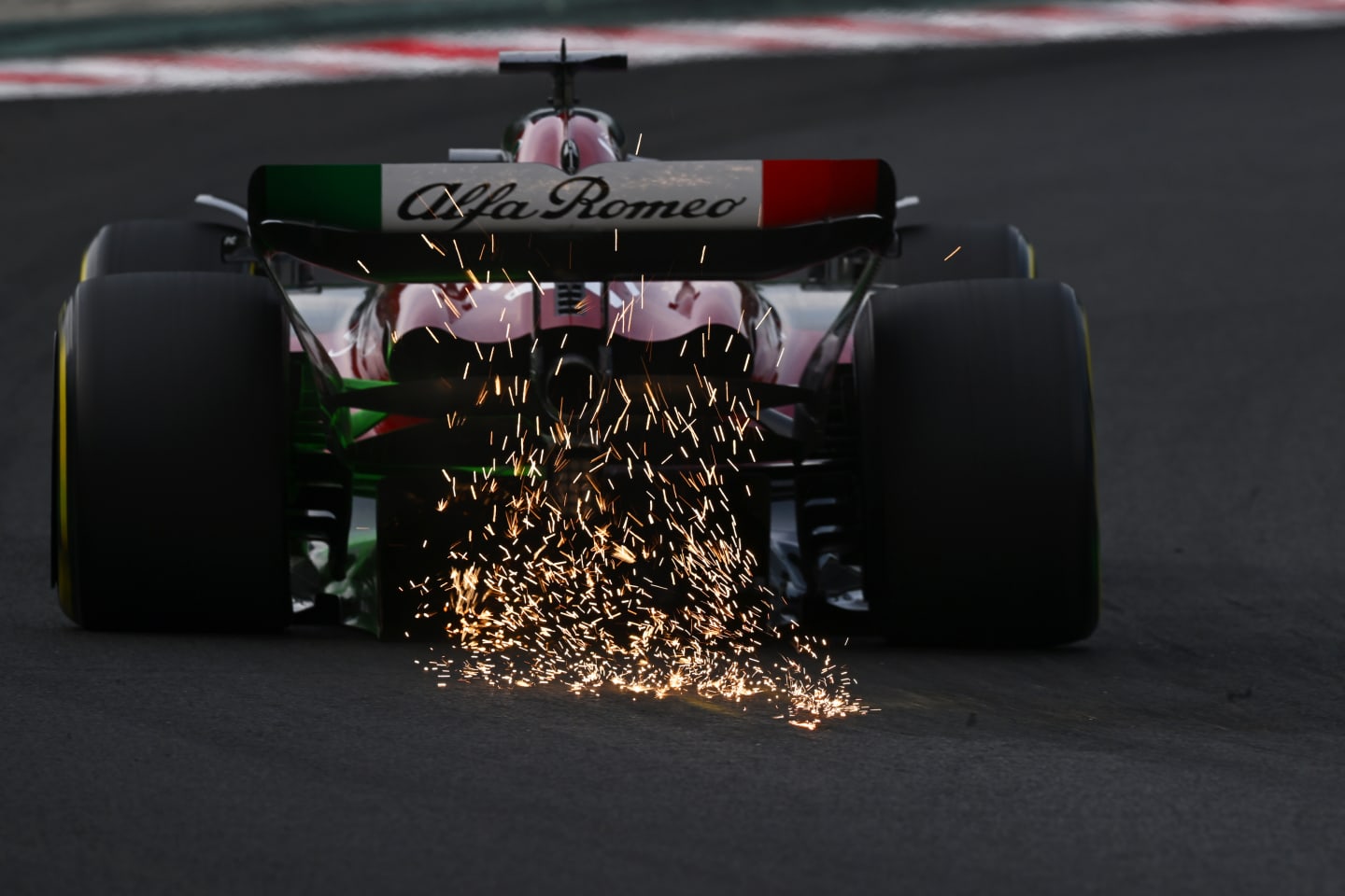 BUDAPEST, HUNGARY - JULY 21: Sparks fly behind Valtteri Bottas of Finland driving the (77) Alfa Romeo F1 C43 Ferrari during practice ahead of the F1 Grand Prix of Hungary at Hungaroring on July 21, 2023 in Budapest, Hungary. (Photo by Dan Mullan/Getty Images)